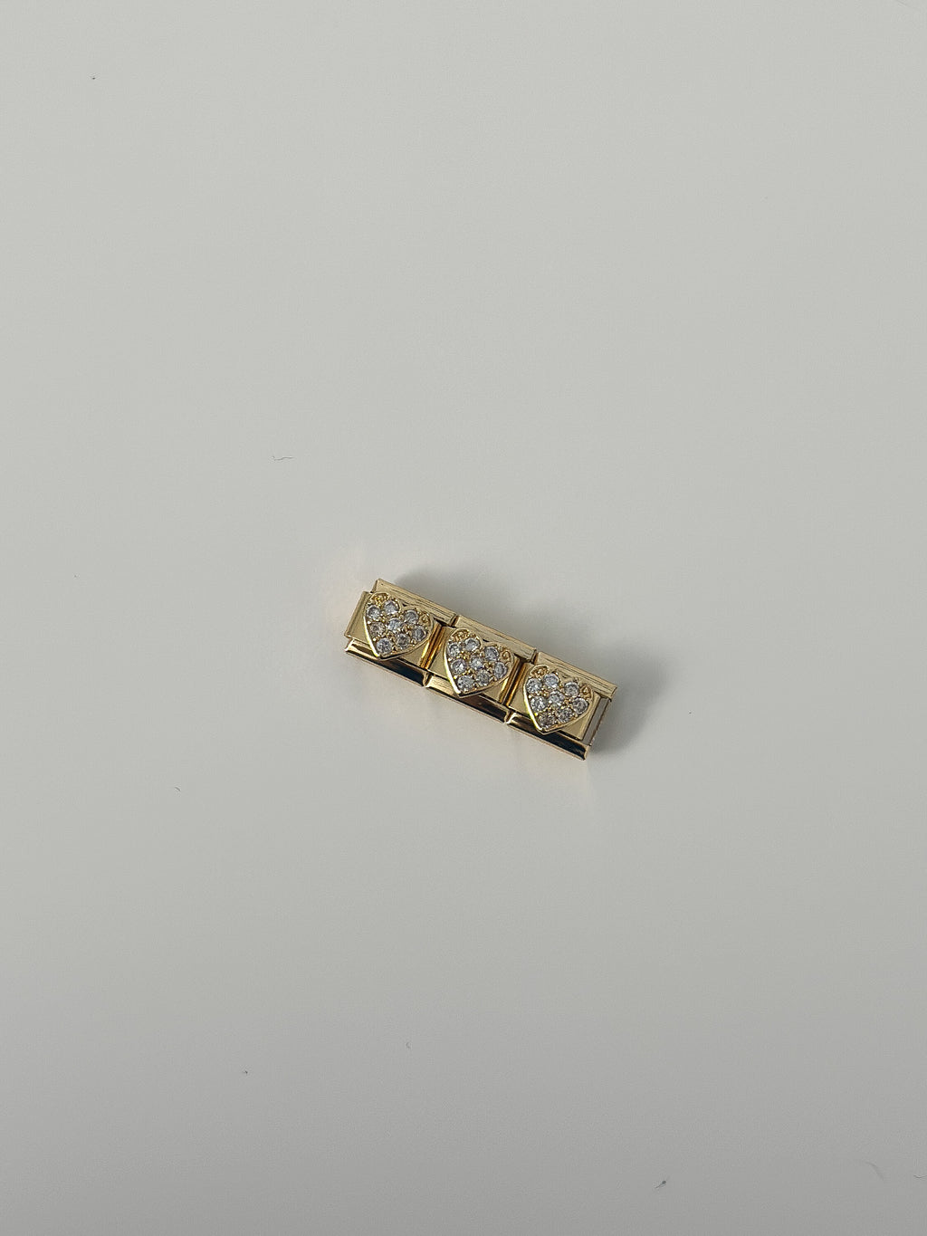 strong gold heart charm