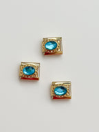 gold blue stone charm