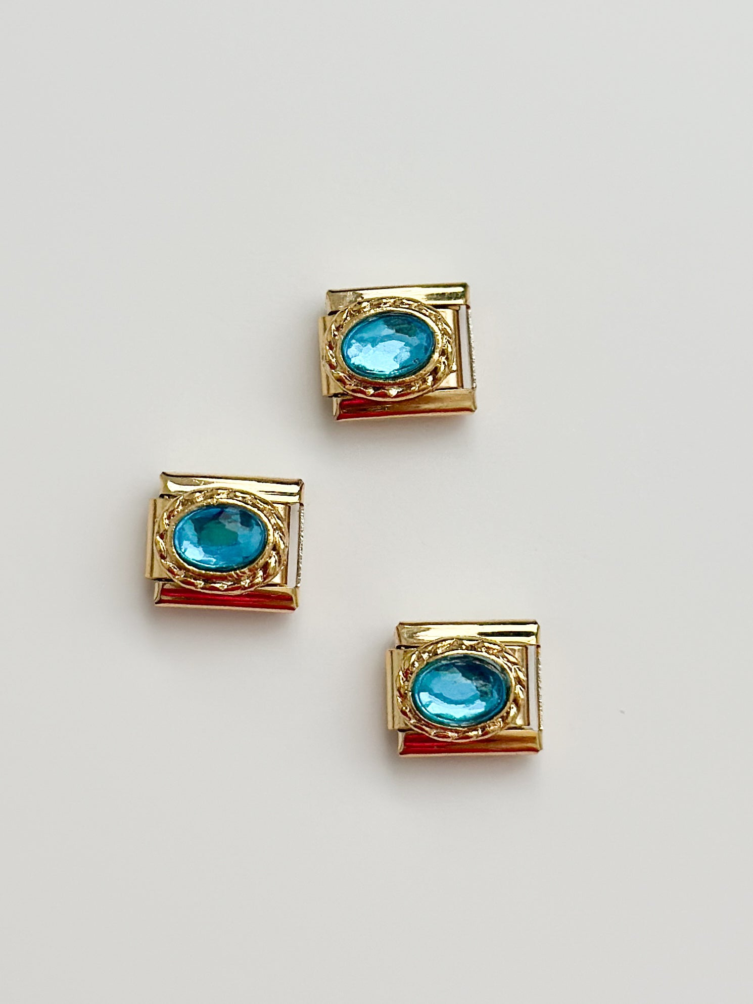 gold blue stone charm